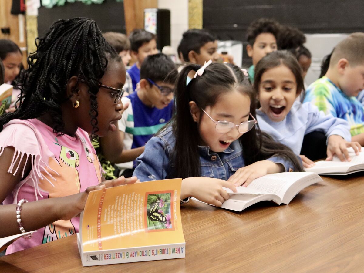 Third-graders excited by gift of dictionaries from Rotary Club 