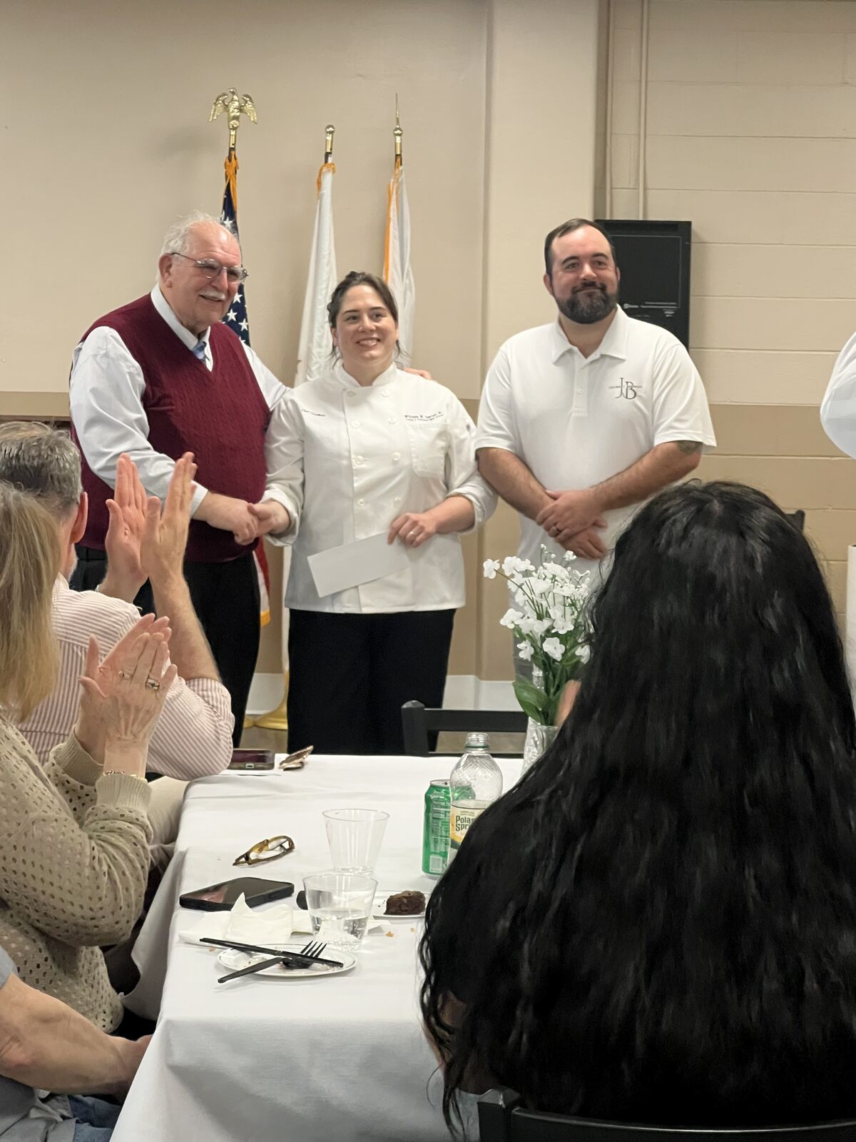 Chef Lingwall and Chef Opalinik of the RI ACF accepting a donation for the Davies Hospitality Scholarship fund.  