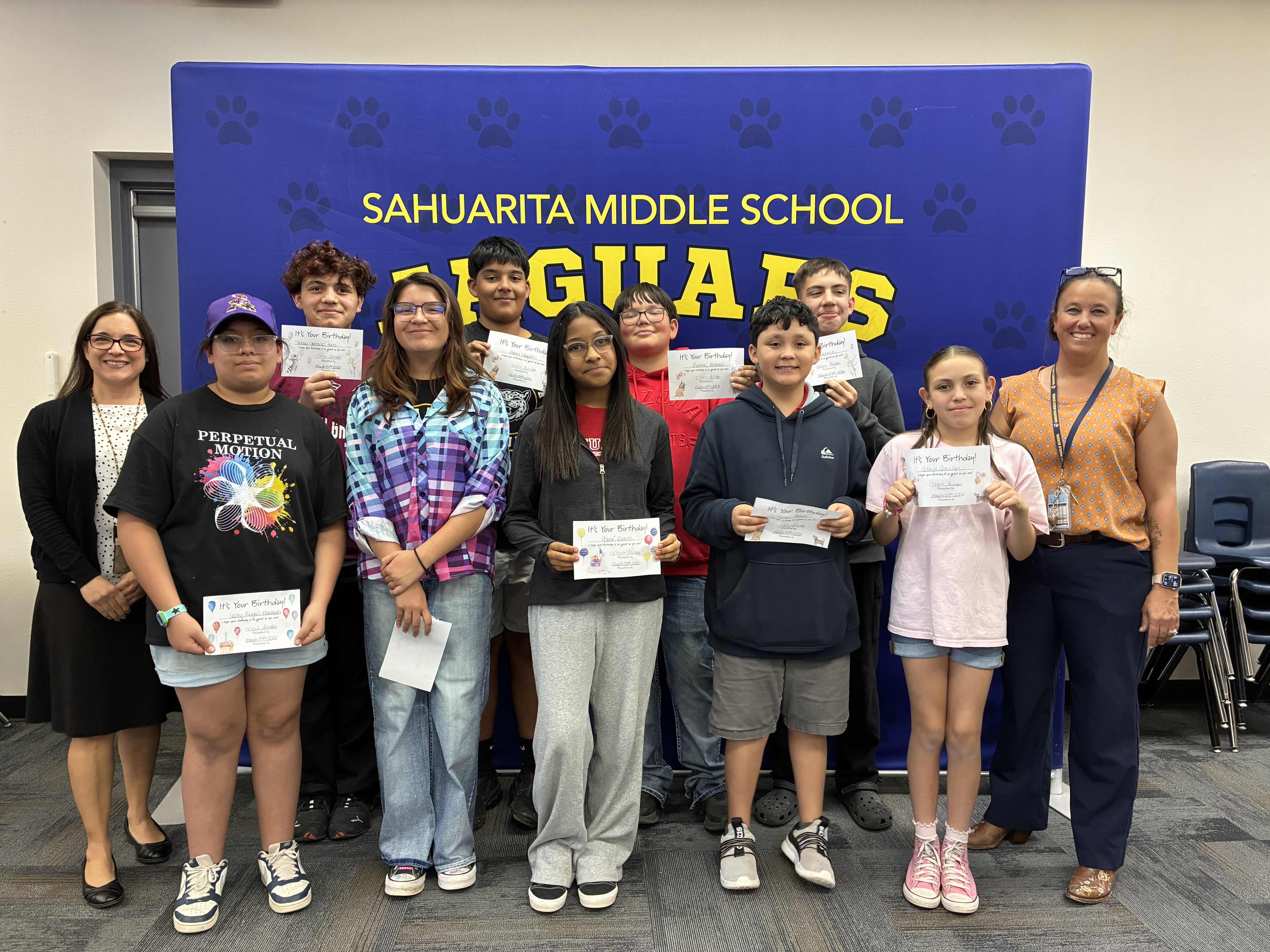 Students with birthday certificates