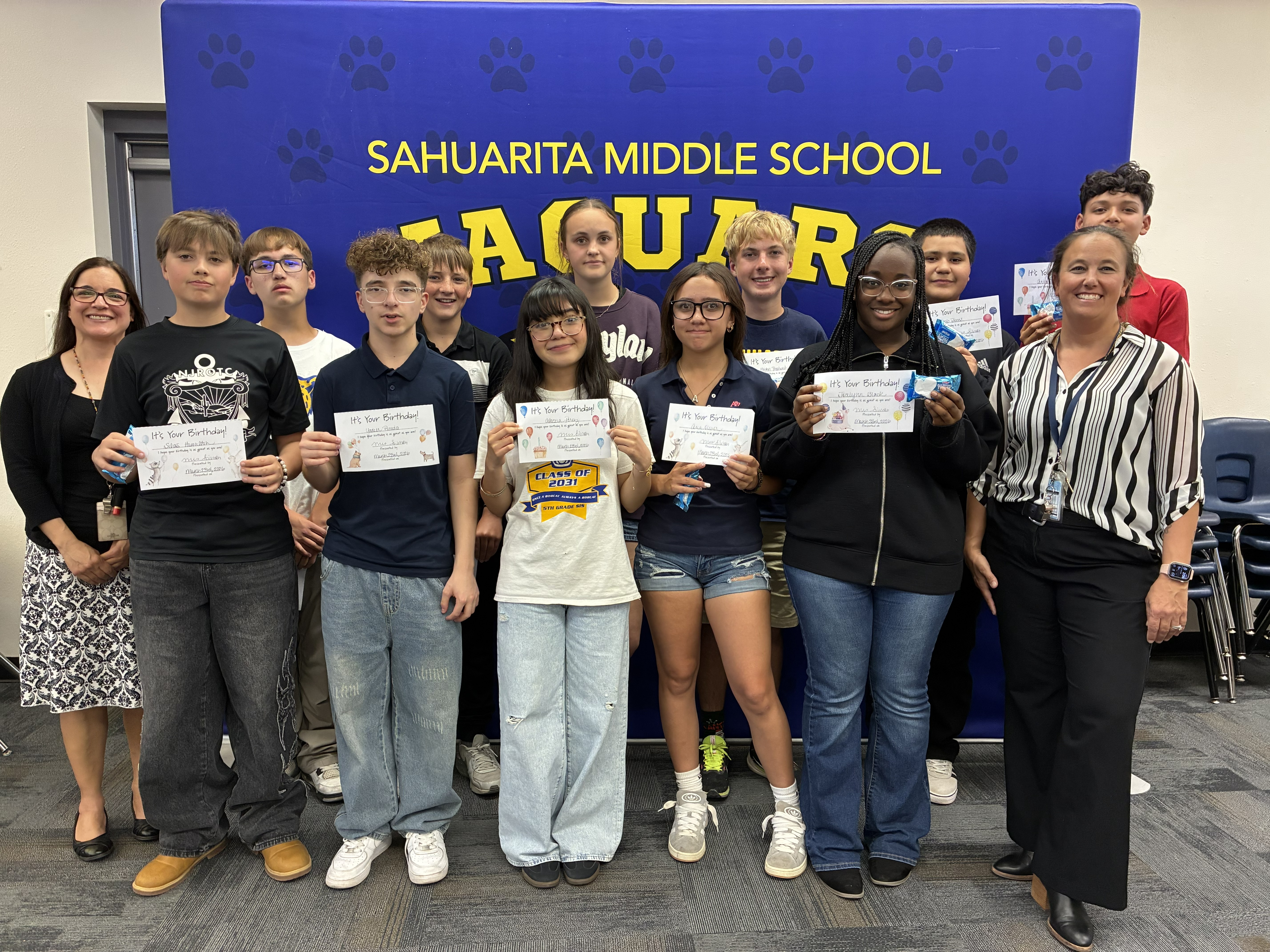 Students with birthday certificates