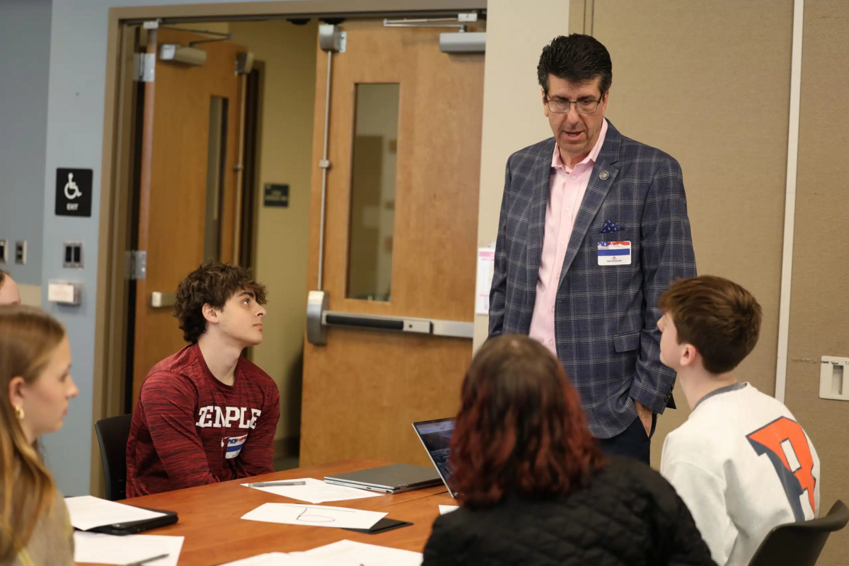 PA Representative Joe Ciresi speaking to a table of highschool kids