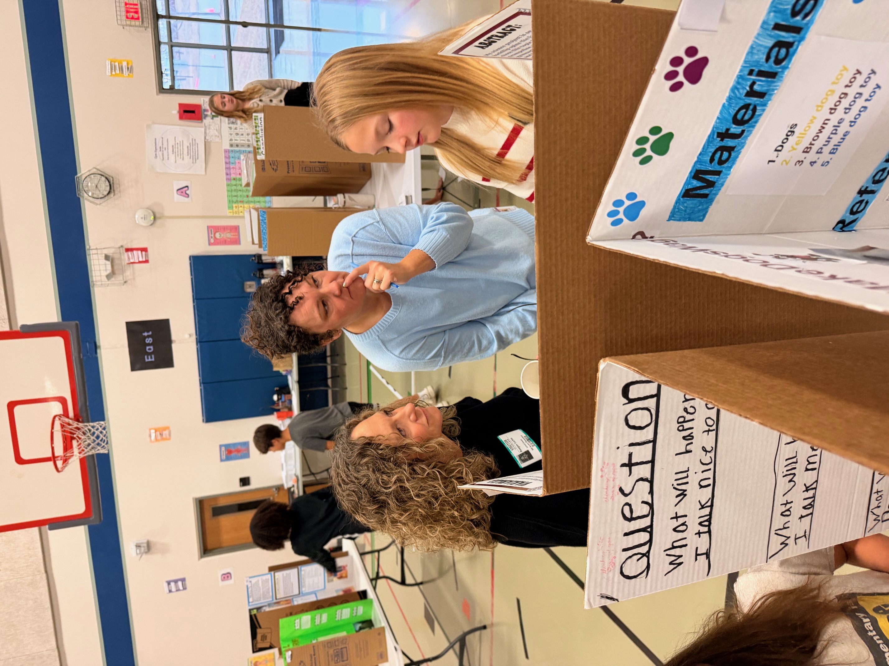 science fair judges with student