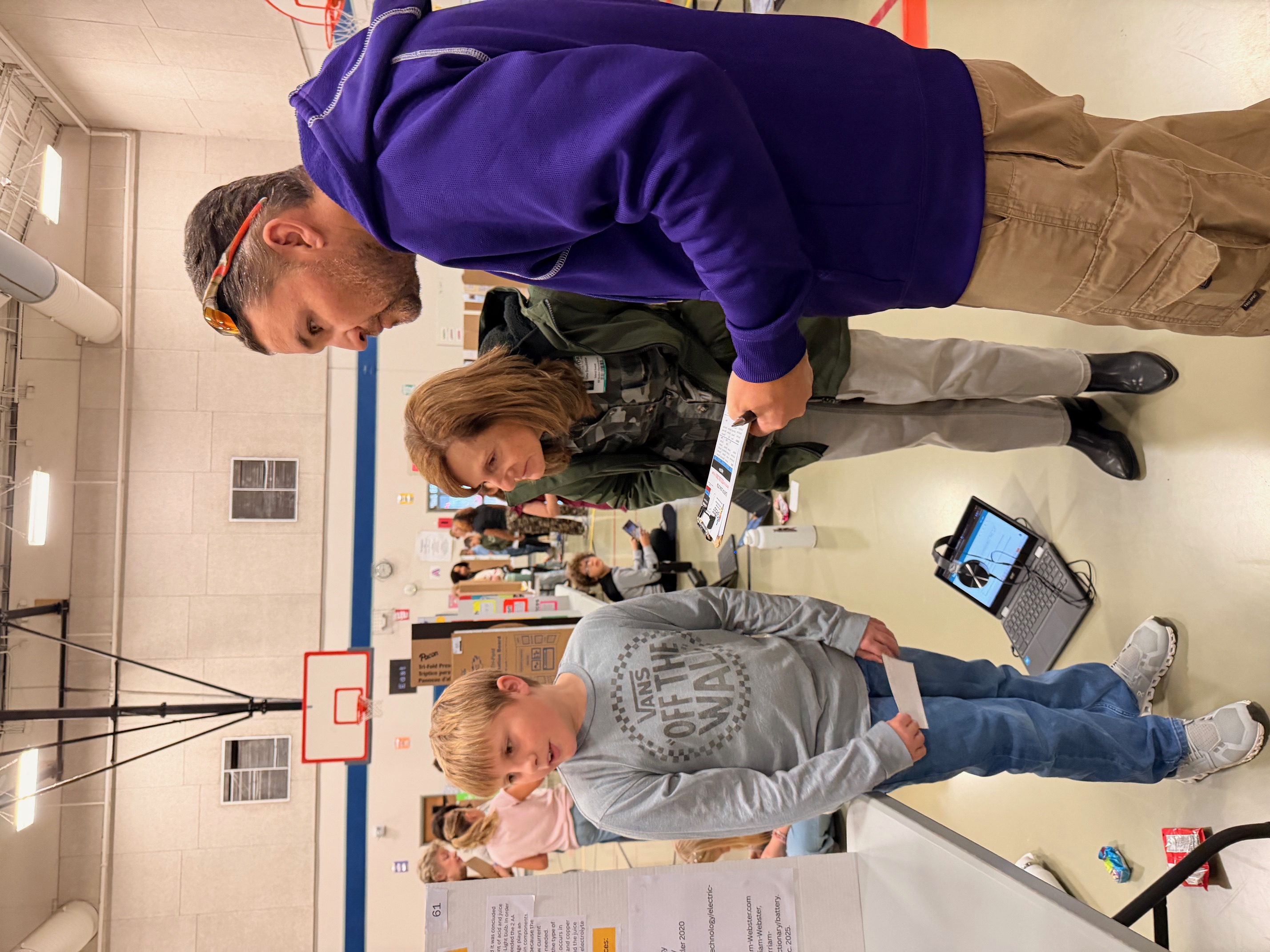 science fair judges with student