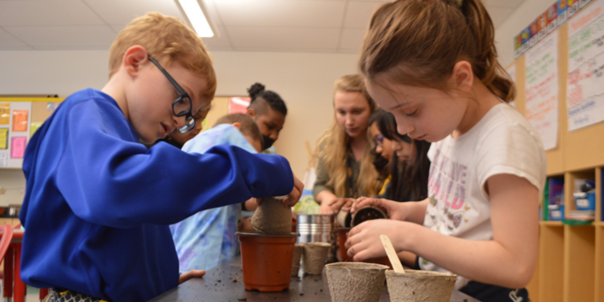 Students work on planting in Garden Club. 