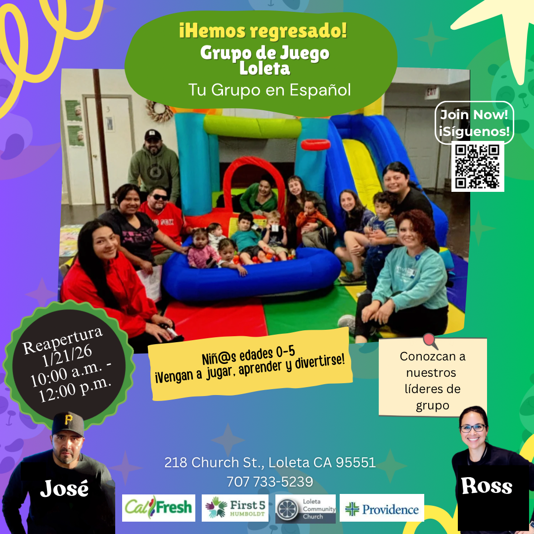 A group of adults and children are gathered around an inflatable play structure, smiling and interacting.