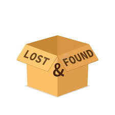 An open cardboard box with 'LOST & FOUND' printed on its flaps.