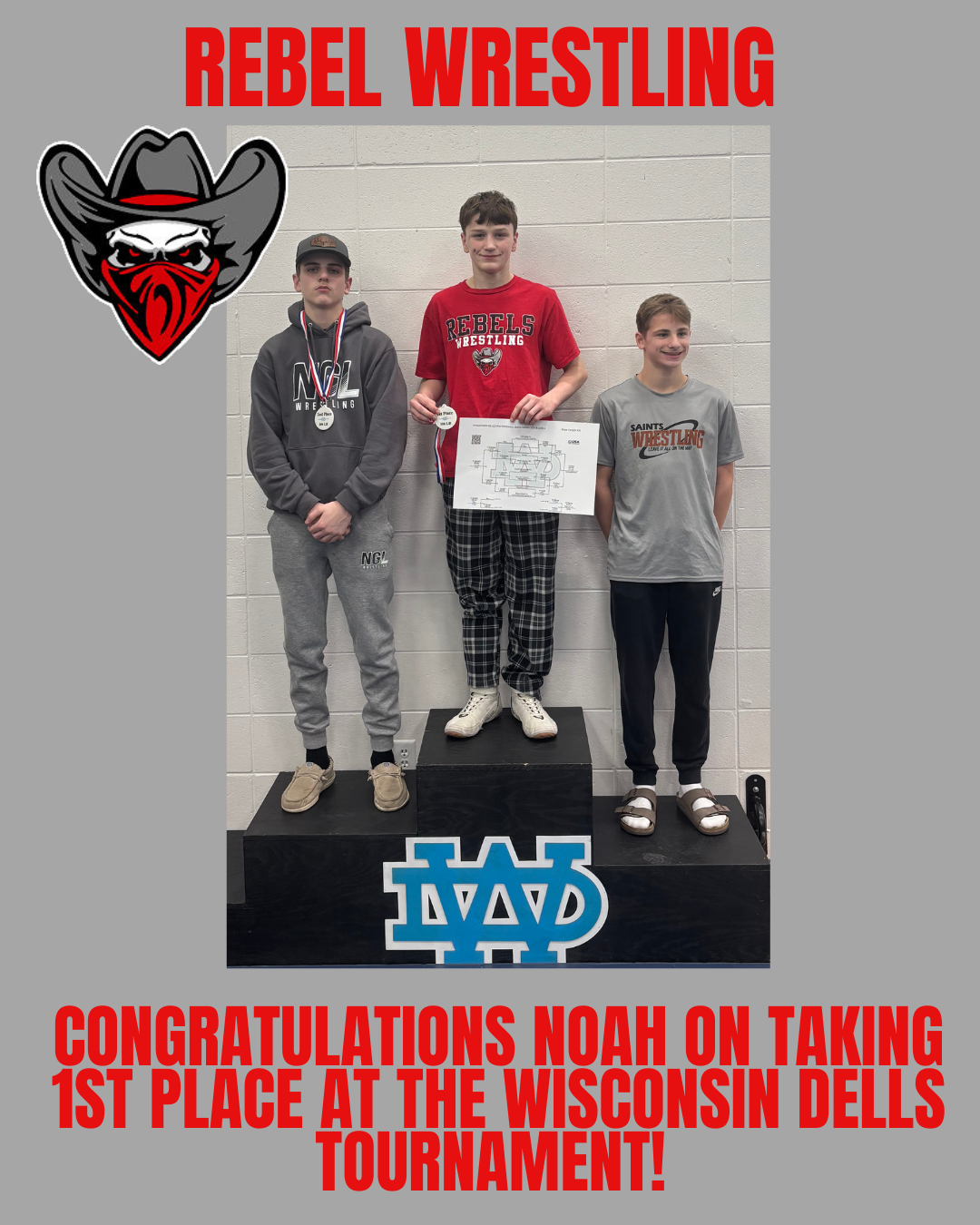 Three young wrestlers stand on a podium, with the center wrestler holding a medal and bracket. Text reads 'REBEL WRESTLING' and 'CONGRATULATIONS NOAH ON TAKING 1ST PLACE AT THE WISCONSIN DELLS TOURNAMENT!'.