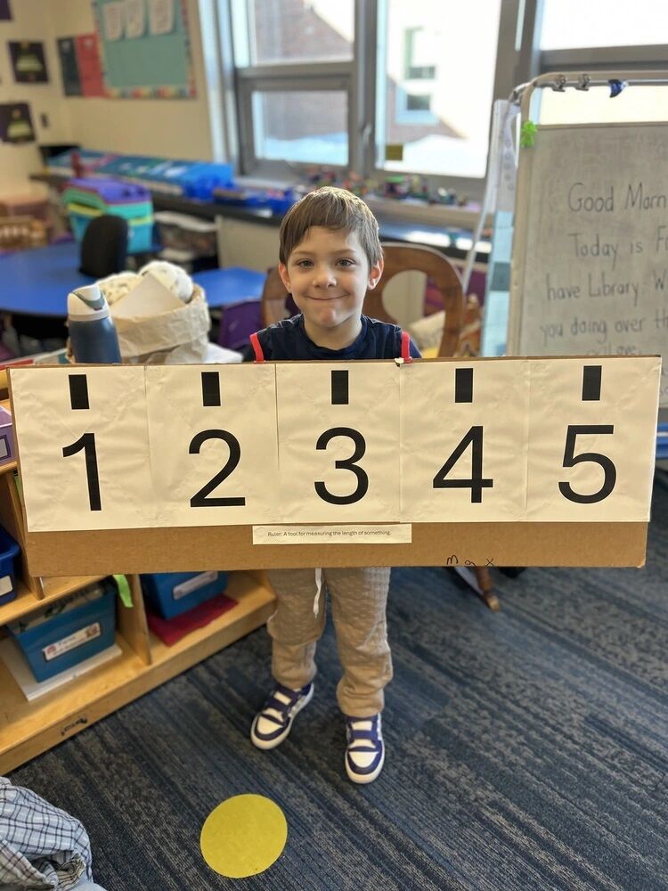 A student in a ruler costume