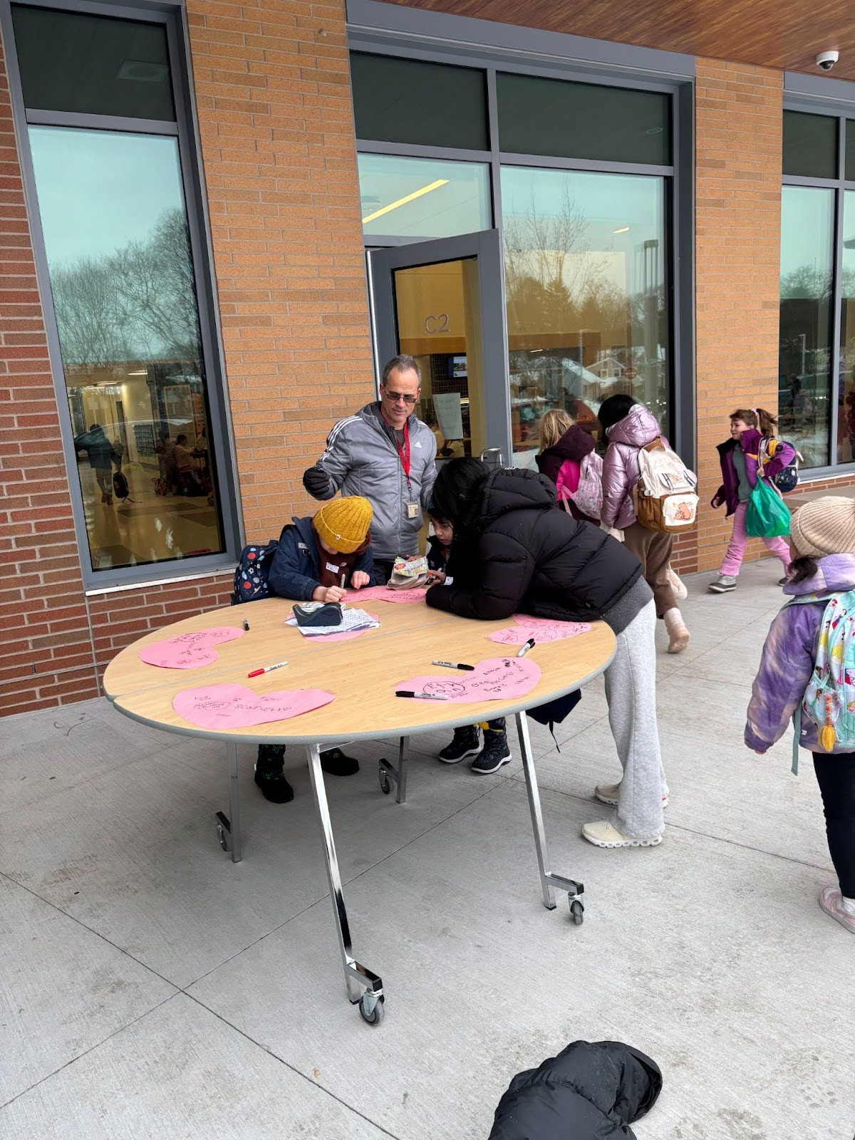 Students check in with Mr. Guzzi during the Cardiac Cruise Walk & Ride to School Day.
