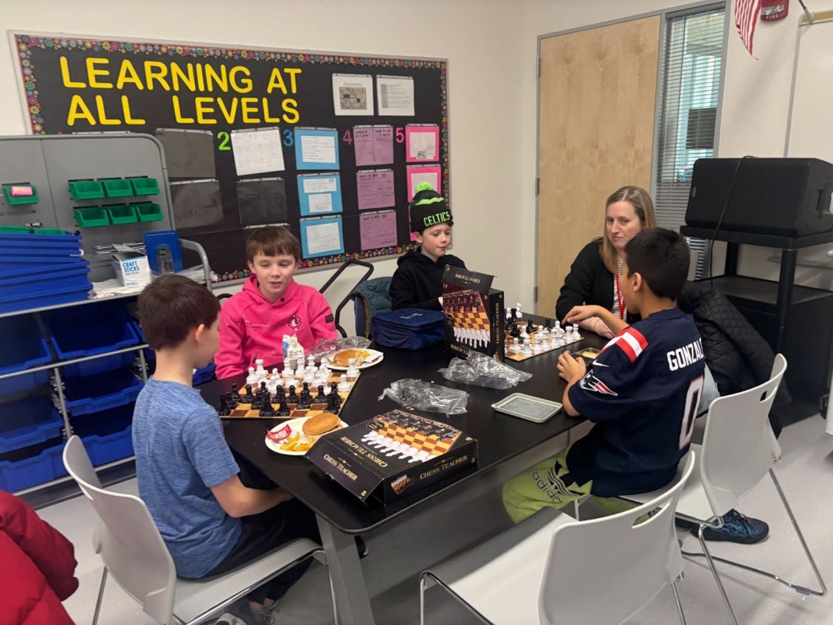 Fifth grade students play chess at Chess Club.