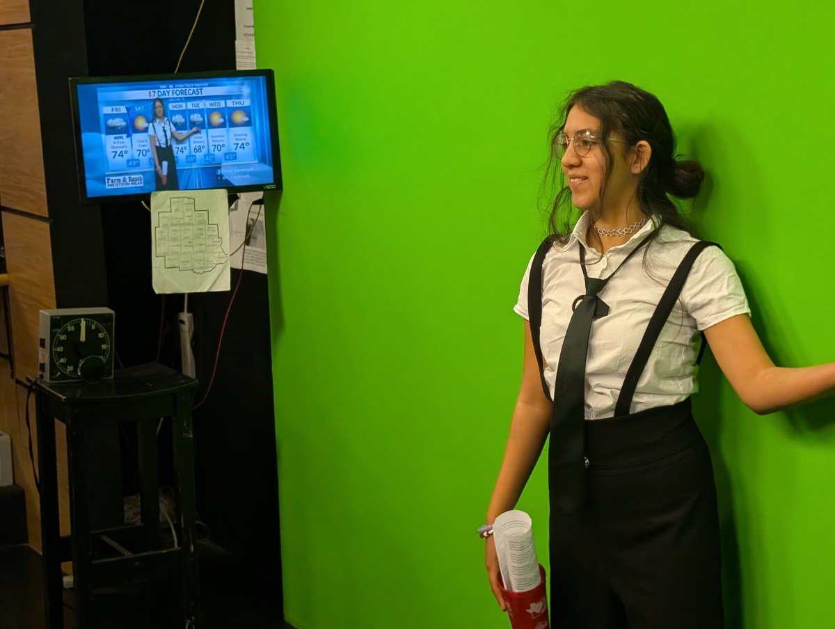 BMS 8th grade A/V student, Isabella Vargas, trying out the weather green screen at the KTAB TV news studio.