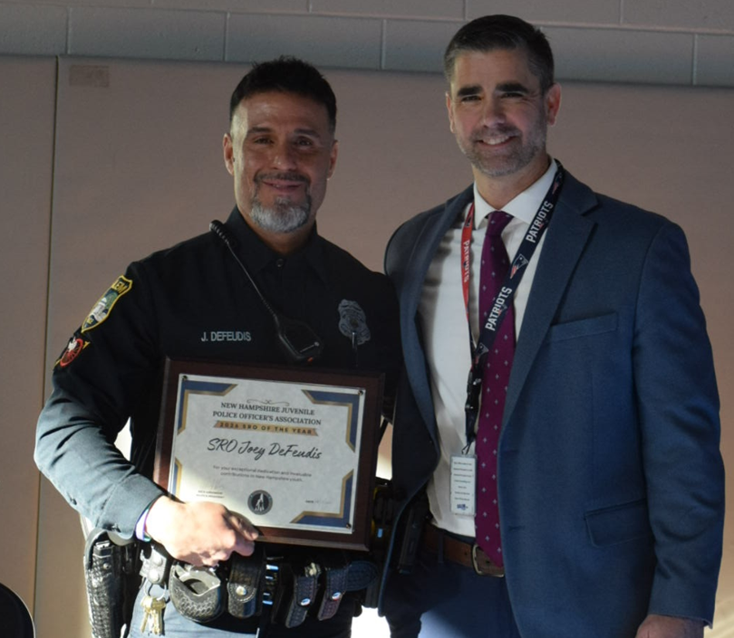 Officer J. DeFeudis receives the 2026 SRO of the Year award from the New Hampshire Juvenile Police Officer's Association.