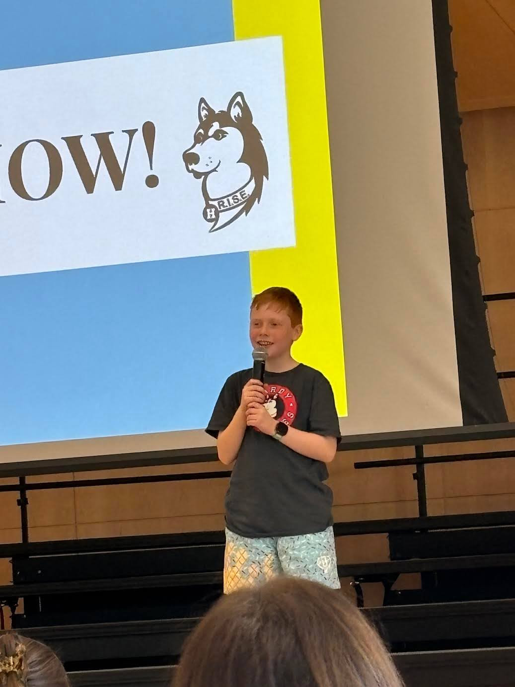 Student performs at talent show. 