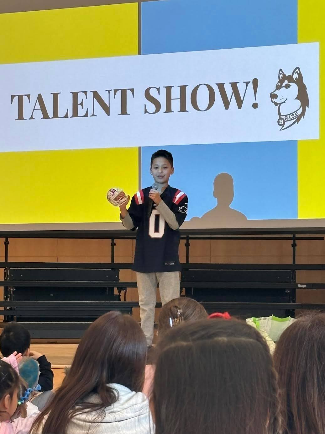 Student performs at talent show. 