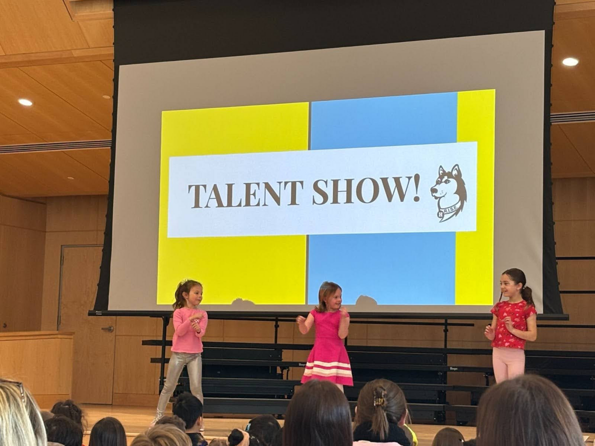 Three girls perform at talent show