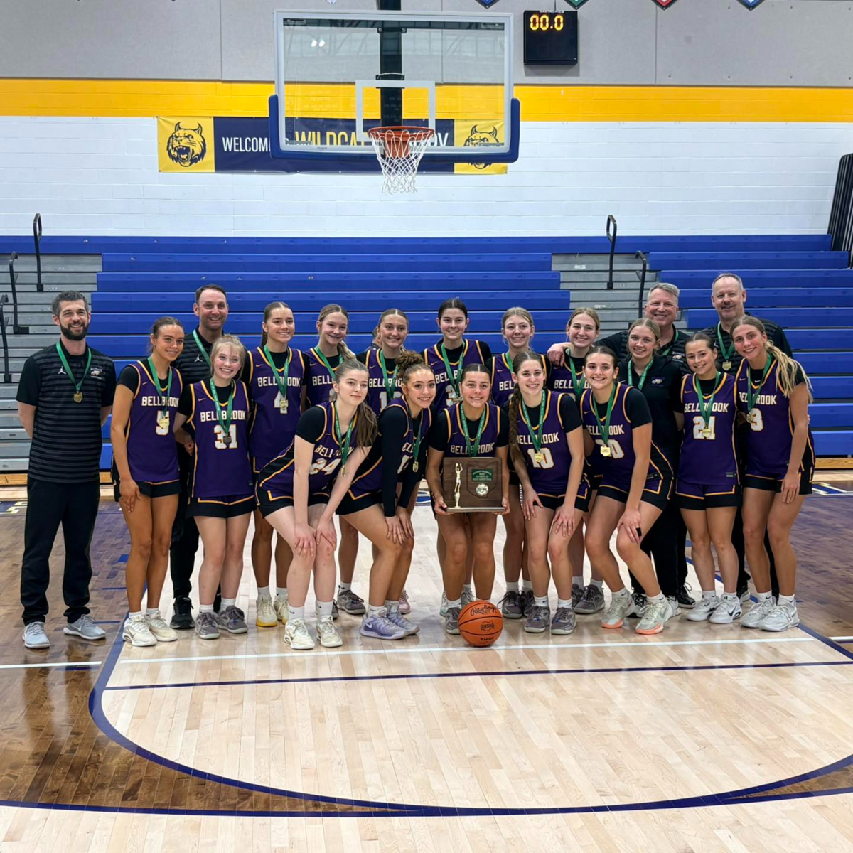 The Bellbrook Girls basketball team poses for a photo with the district title trophy