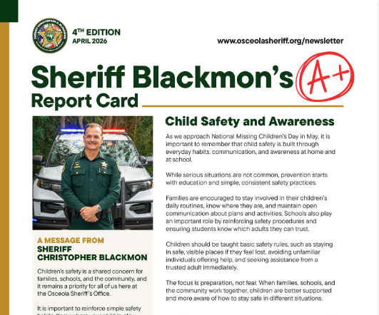 Sheriff Christopher Blackmon in uniform stands in front of a patrol car, with the headline 'Sheriff Blackmon's Report Card' and 'Child Safety and Awareness'.