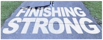 White text on a path reads 'FINISHING STRONG' with a person's legs visible at the top.