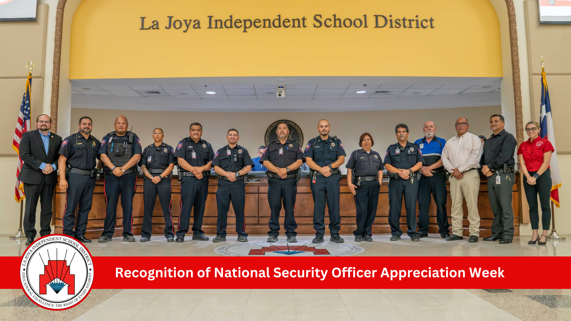 A diverse group of security personnel stand in a line inside the La Joya Independent School District building, posing for a photo.