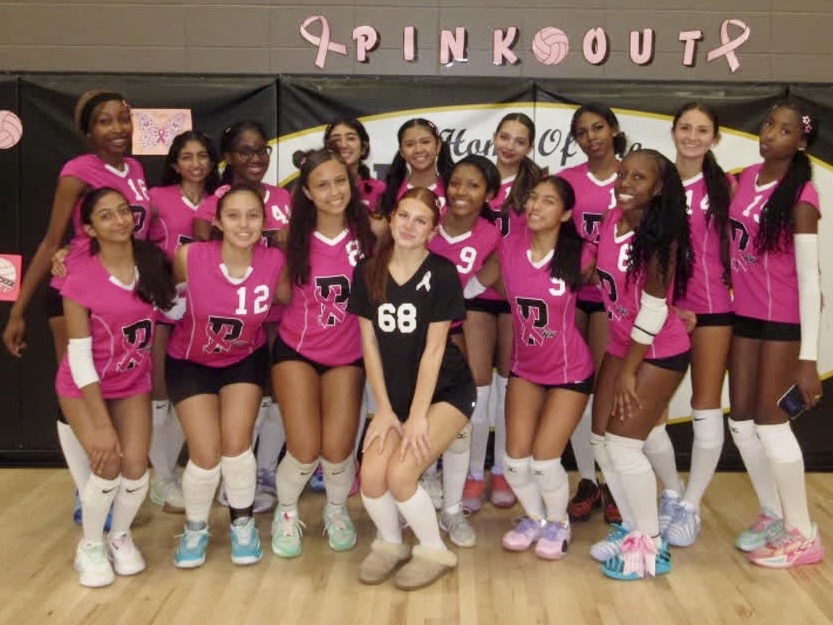 girls volleyball team dressed in pink