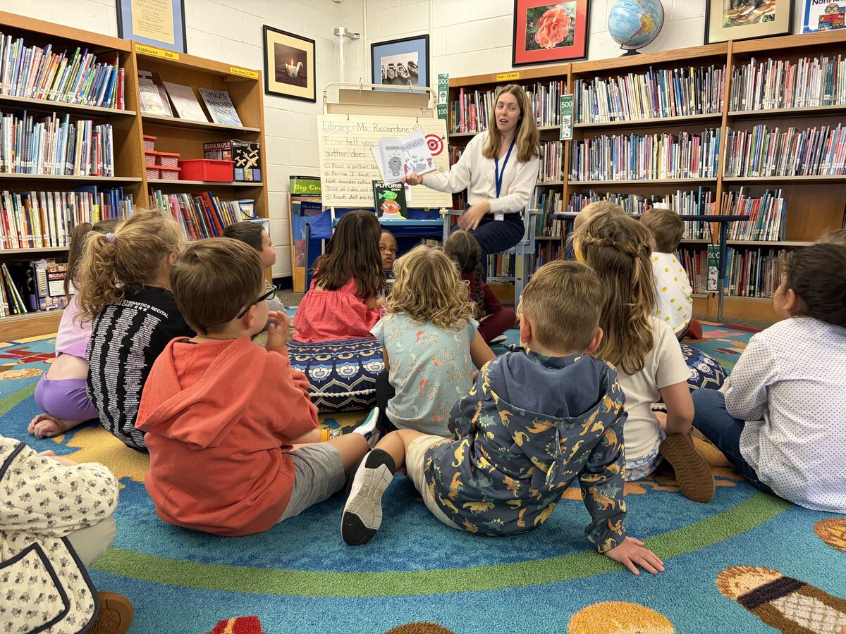 Our new kindergarten friends are enjoying a story.