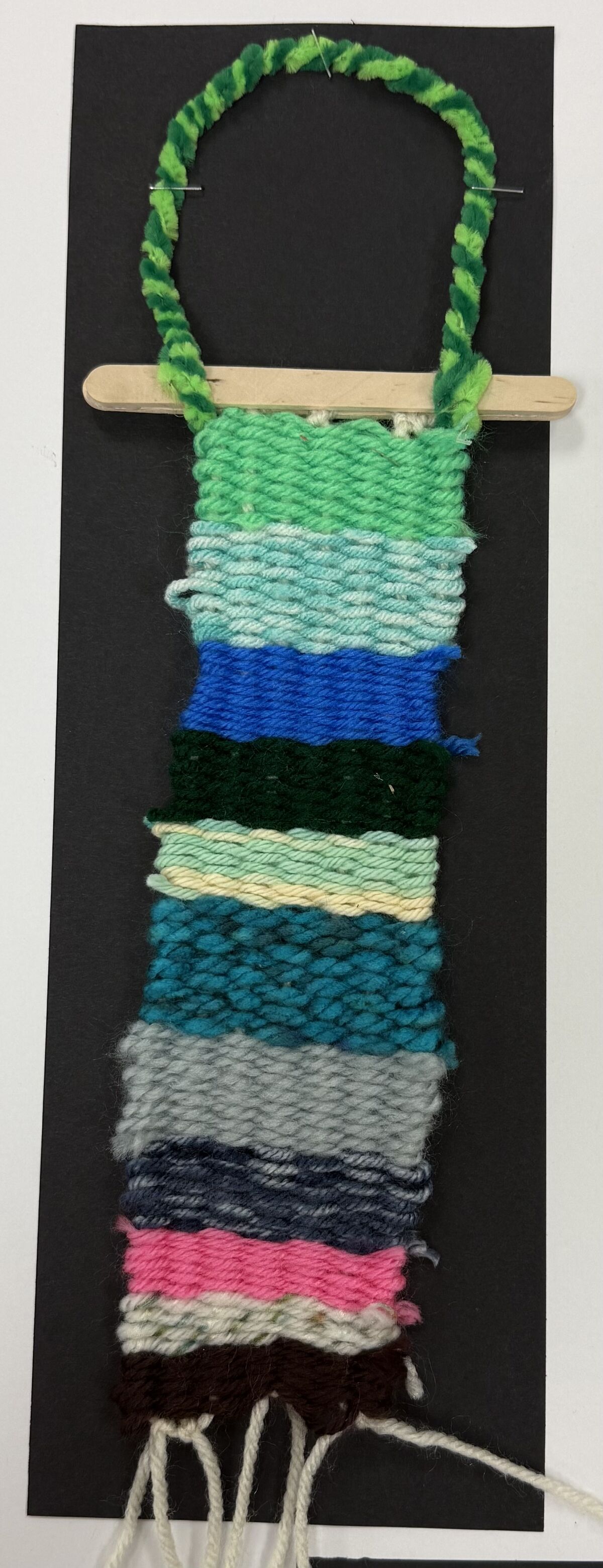 Colorful doorhanger made out of string