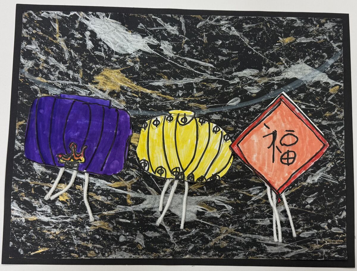 A purple, yellow and orange kite flying in front of a dark sky