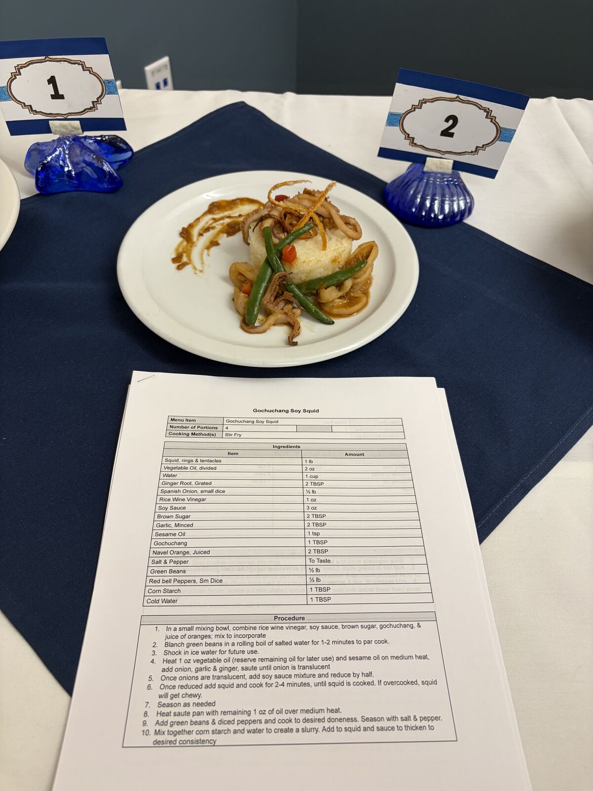 The finished competition dish: Gochuchang Soy Squid served with rice and green beans.