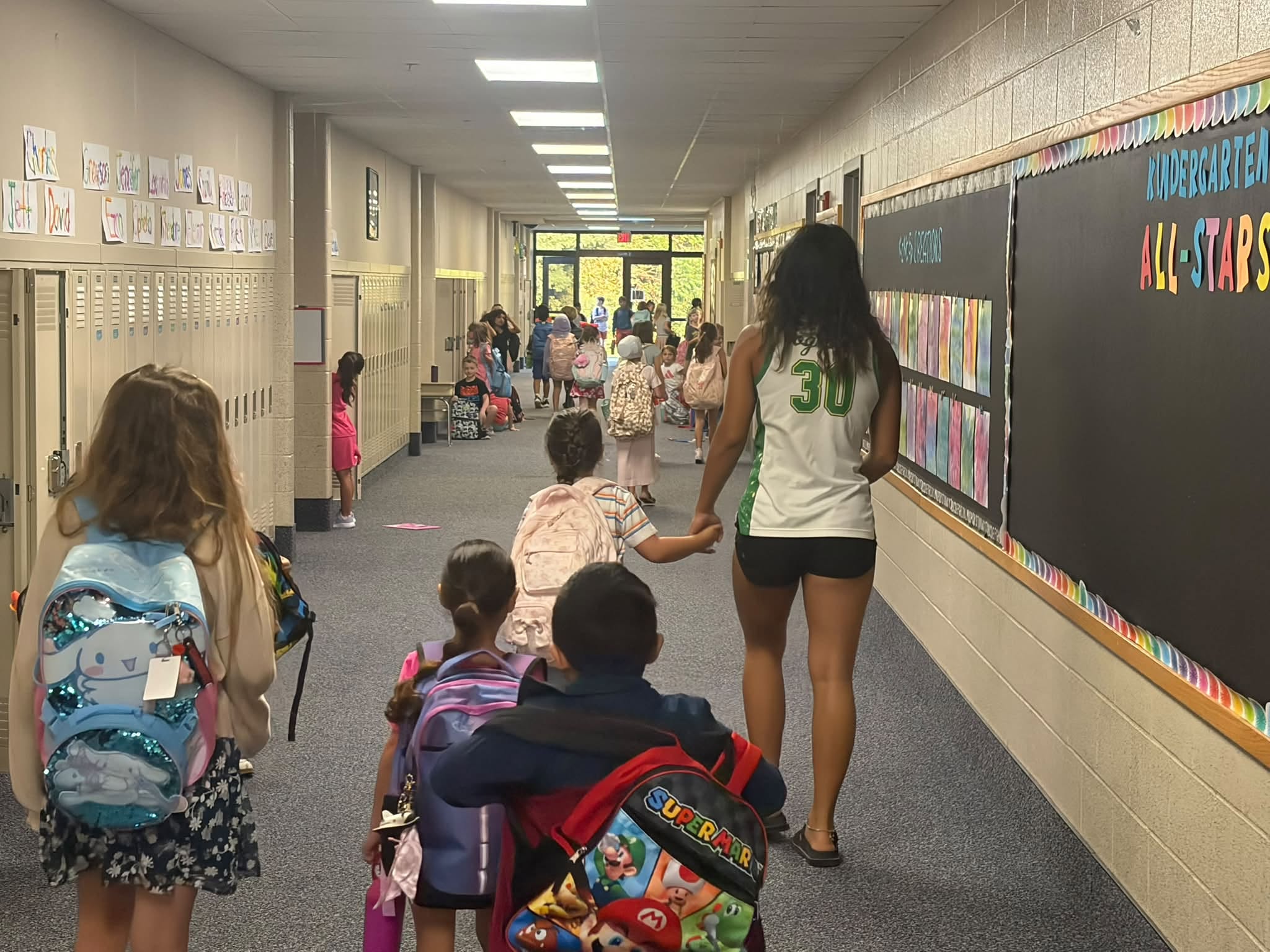 NHS Girls Team Welcomes Students To School