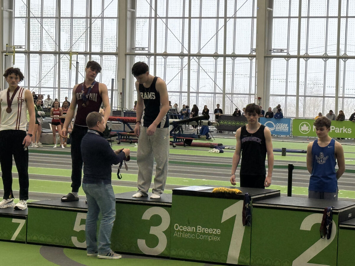 George receiving his bronze medal at the NYS Indoor Track & Field Championships
