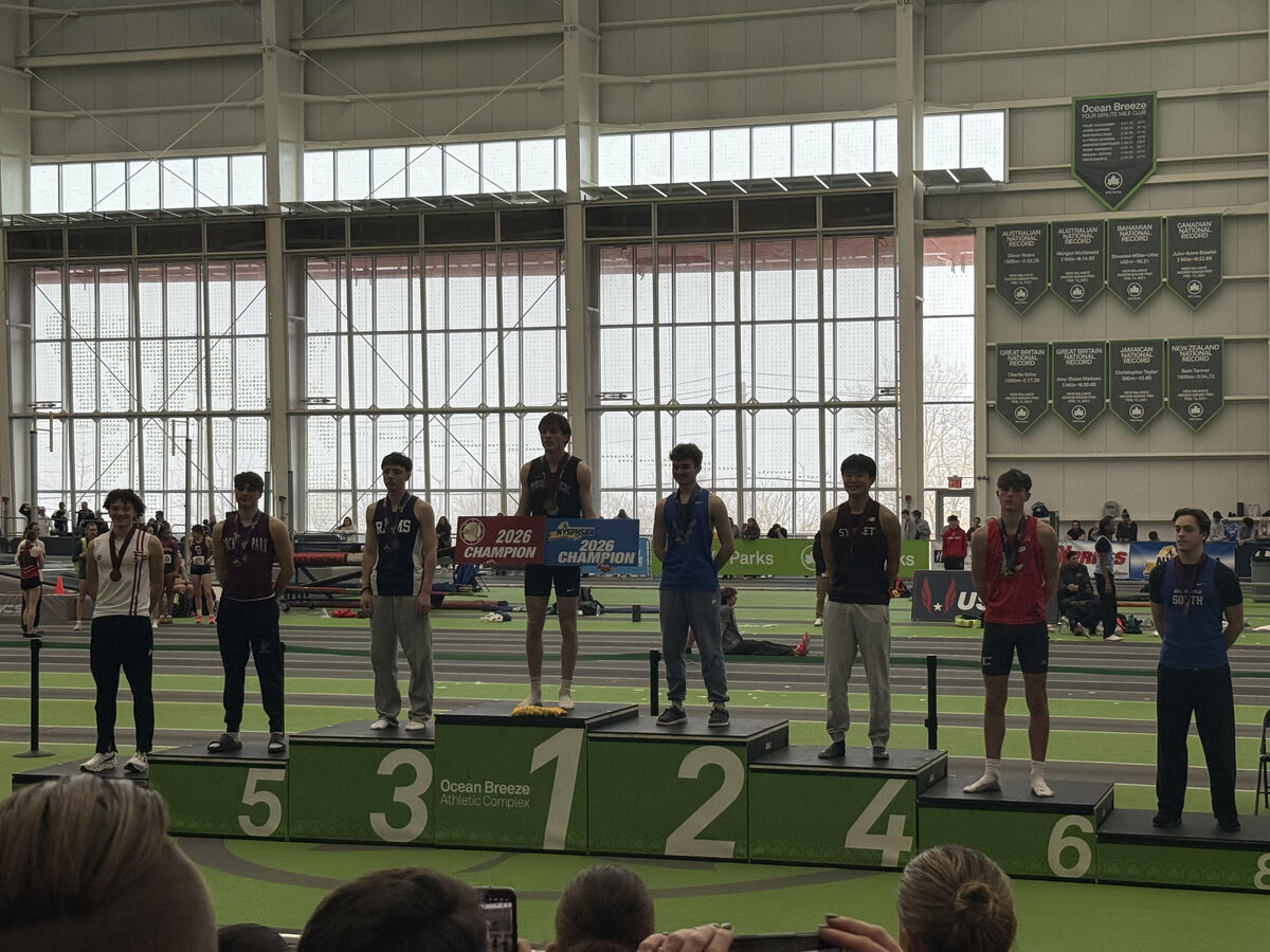 George at the podium with his bronze medal at the NYS Indoor Track Championships