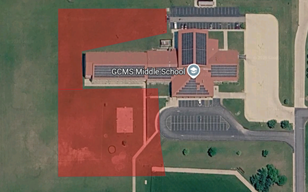 Aerial view of GCMS Middle School with solar panels on the roof.