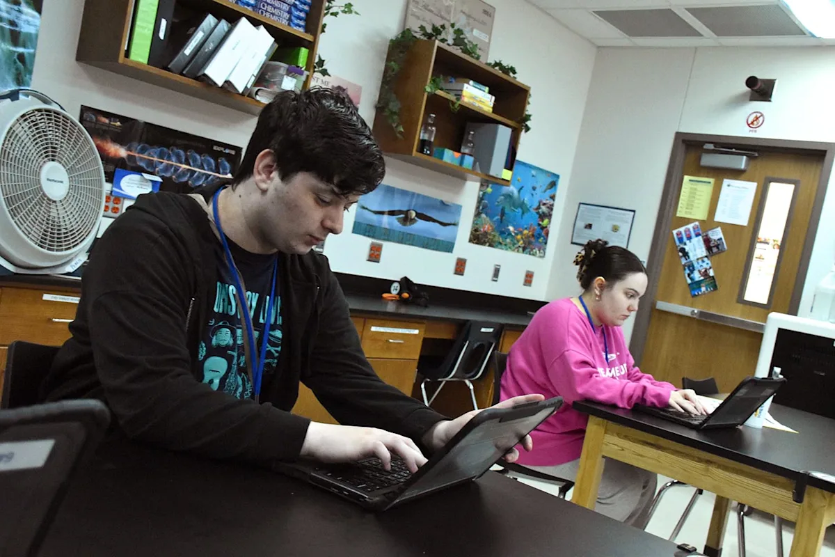 Achieve Academy students working in their classroom.