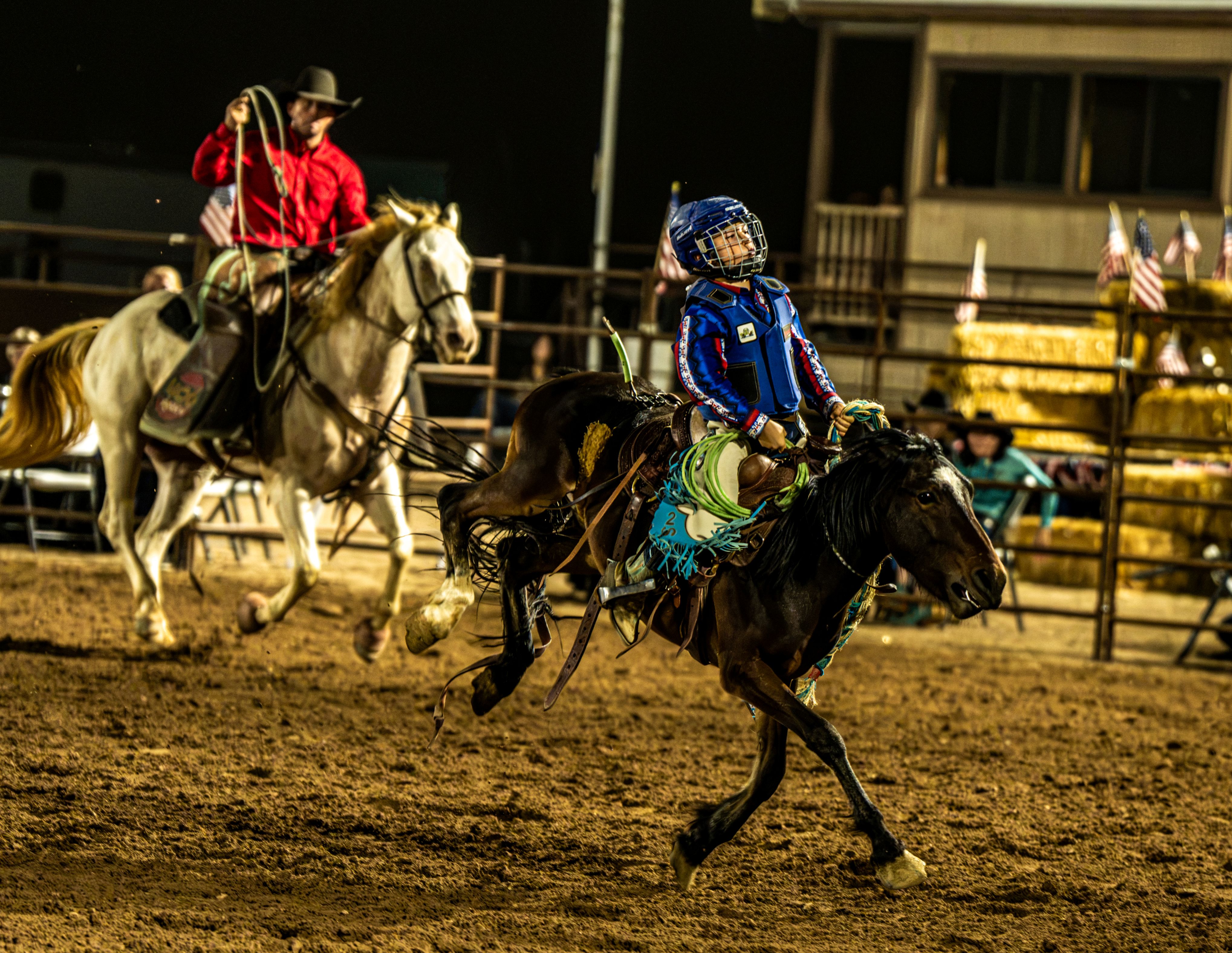 young boy on a bucking horse