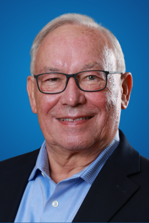 Man in a blue shirt and suit jacket