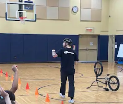 Manny talking to students about kindness and dreams