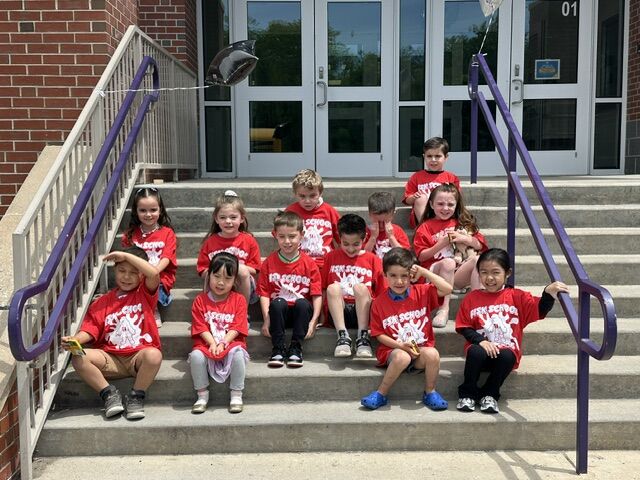 students sitting on steps