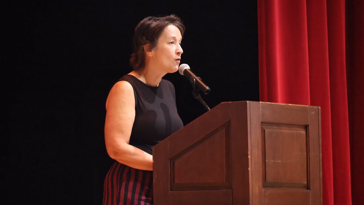Amy Robbins at the podium