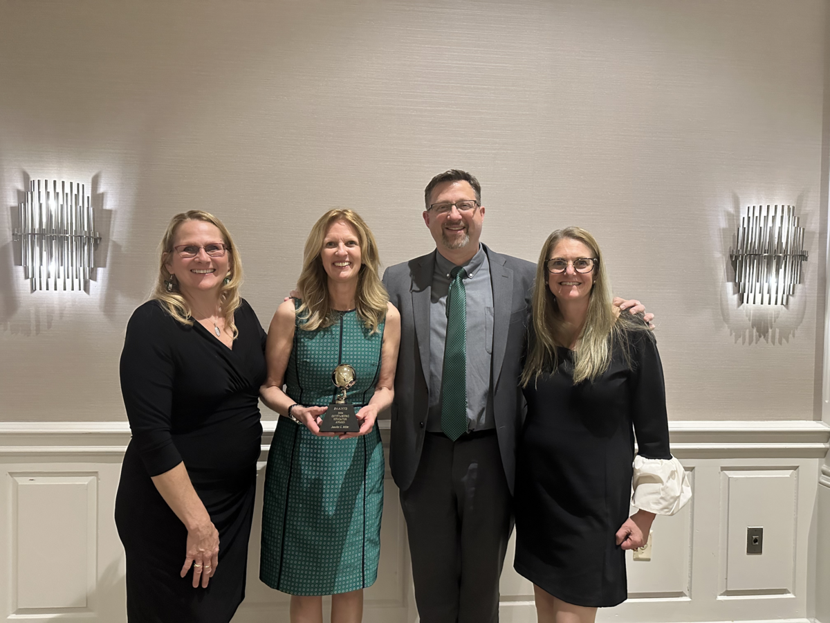 Middle School Principal accepts 'Outstanding Educator of the Year' award 
