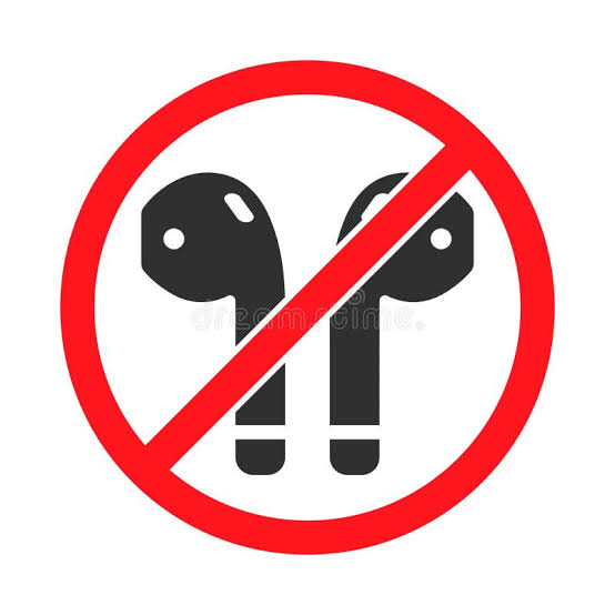 A red circle with a diagonal line through it, indicating 'no' or 'forbidden', superimposed over a silhouette of two wireless earbuds.