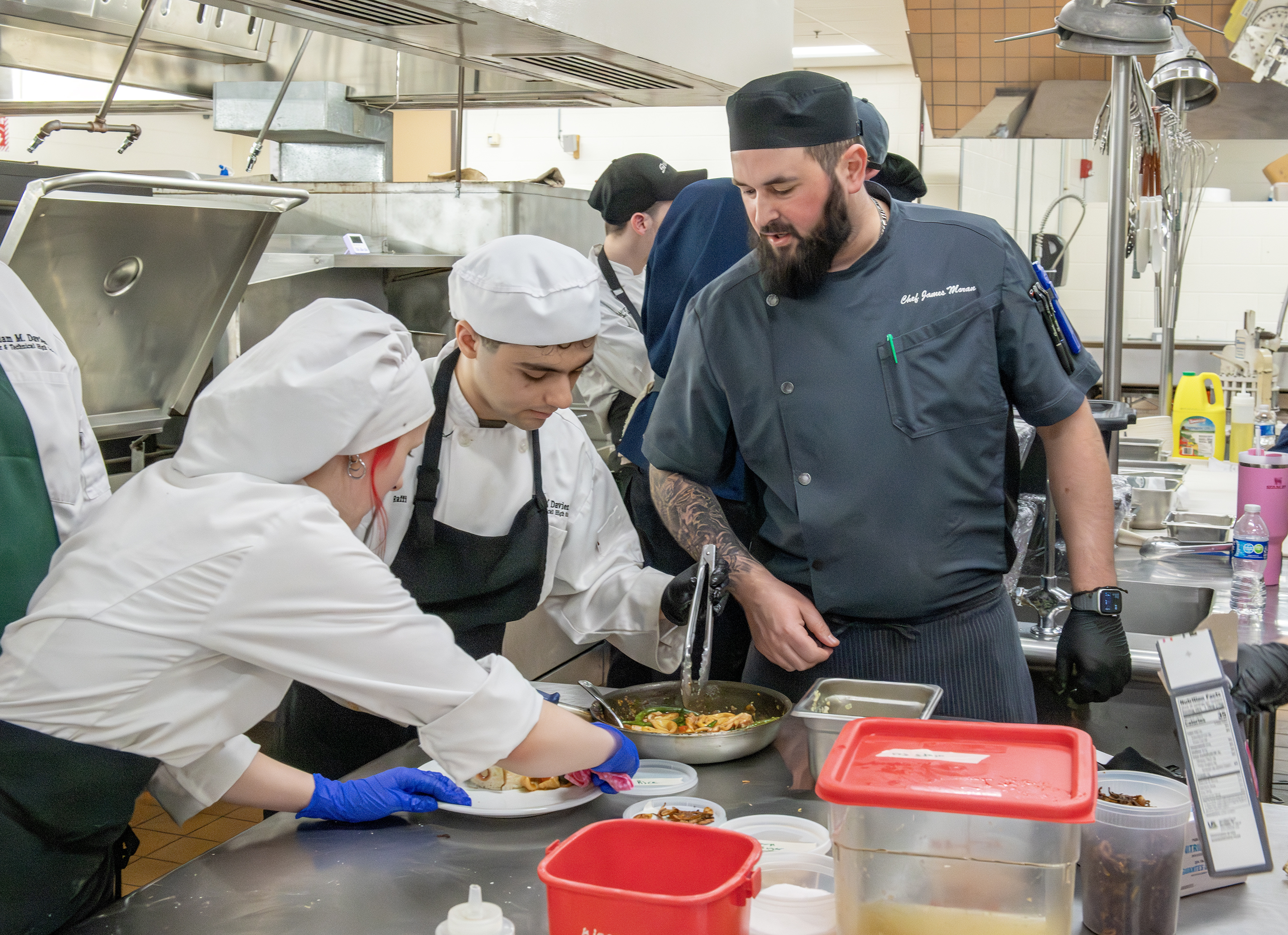 Aeona and Raffi smiling at the competition venue.