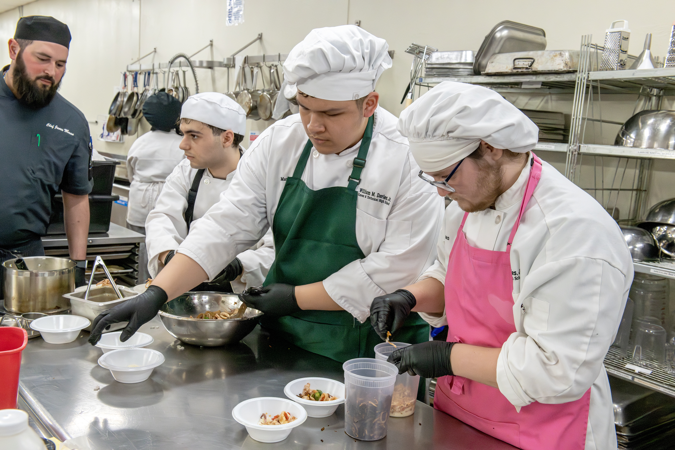 Raffi Mnatsakanian, Mario Nestor, and Jayden Cabral posing together at the Tides event.