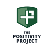 Logo for The Positivity Project, featuring a green shield containing a white cross and 'P' monogram.