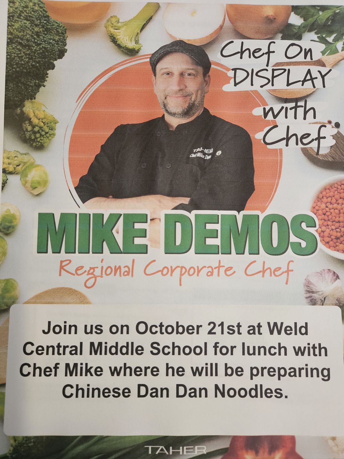 A promotional poster features Chef Mike Demos surrounded by fresh vegetables, announcing a cooking event on October 21st.