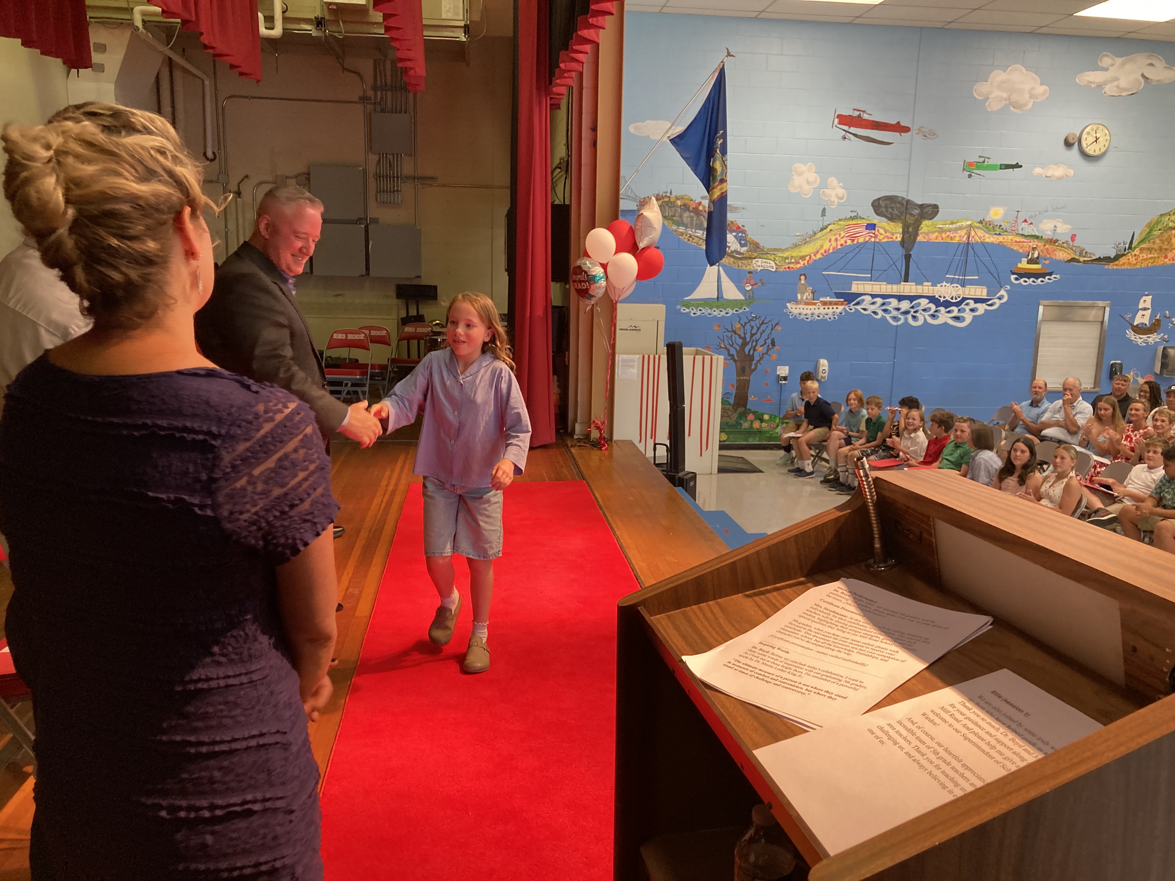 Students get red carpet treatment in bidding Mill Road farewell