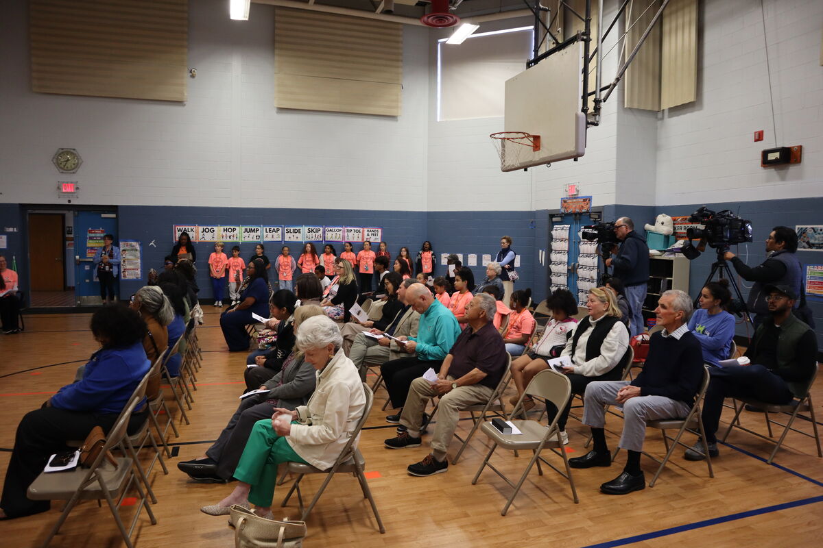 Those in attendance for a ribbon cutting ceremony for the buddy bench dedicated to Malachi James