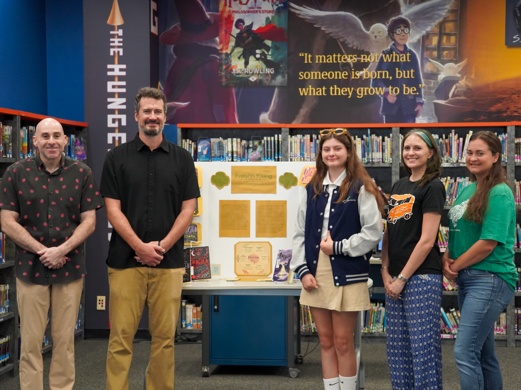 Turning the Page: Former Dwyer Student Brings Dyslexia-Friendly Books to Dwyer Middle School Library