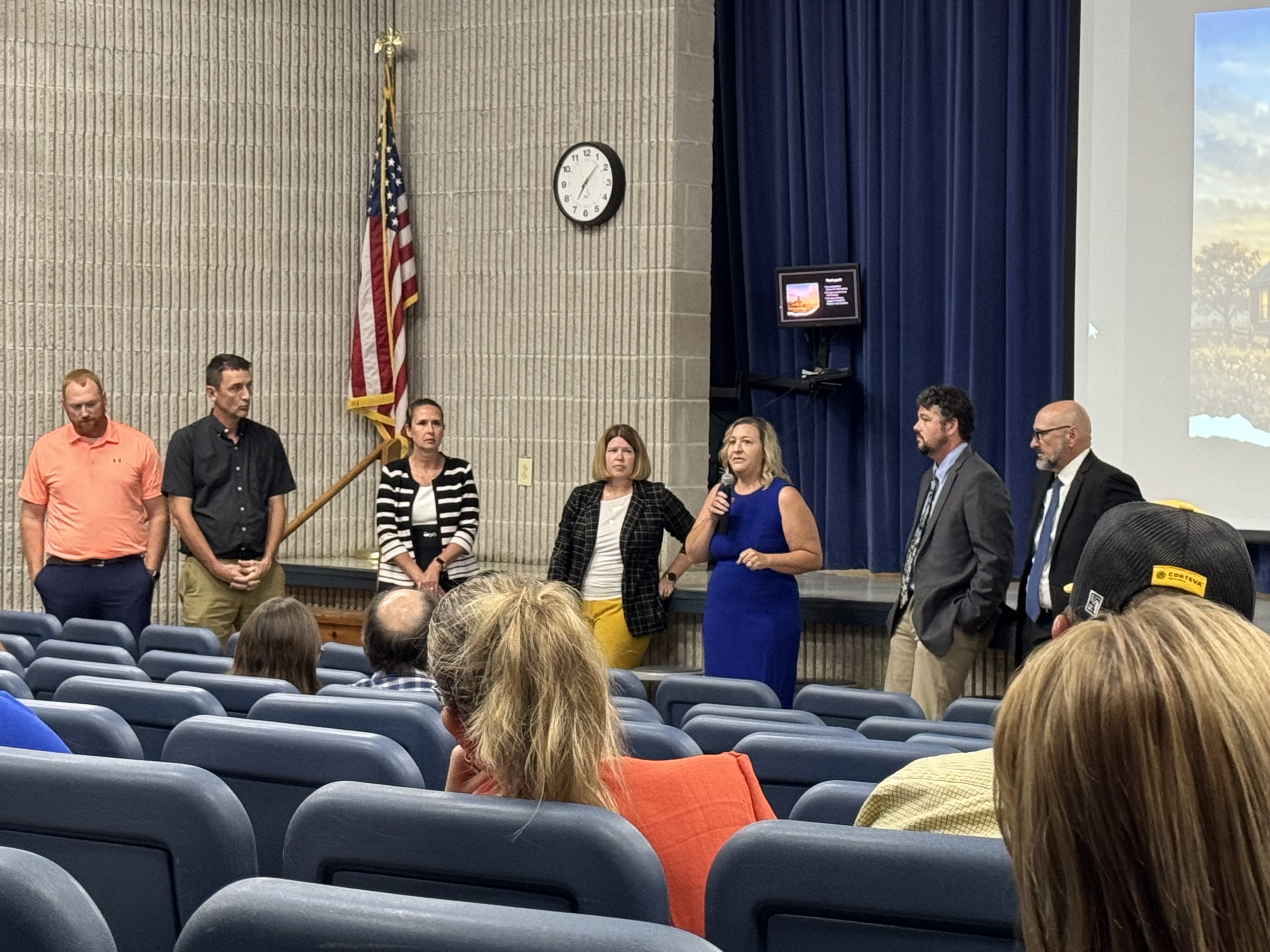 Superintendents from across Northern Missouri are pictured in an auditorium answering questions on a panel. 