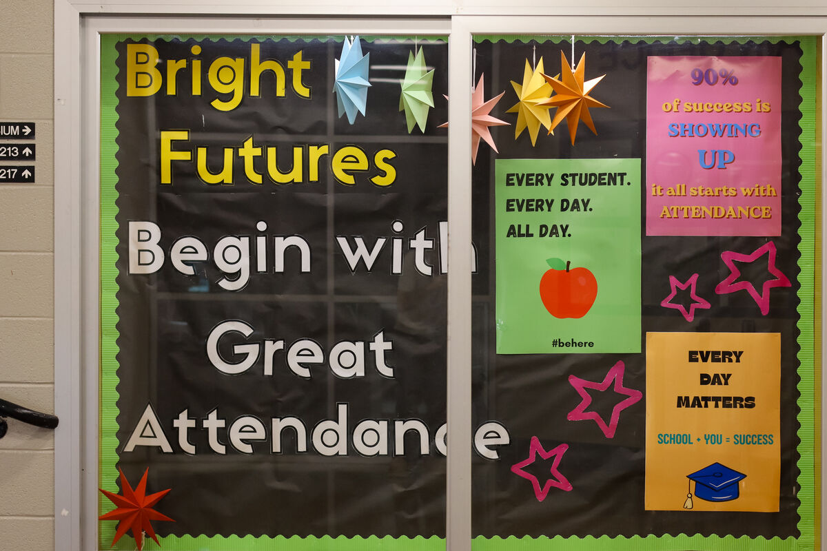 Bulletin board with the message 'Bright Futures Begin with Great Attendance' and colorful star decorations.