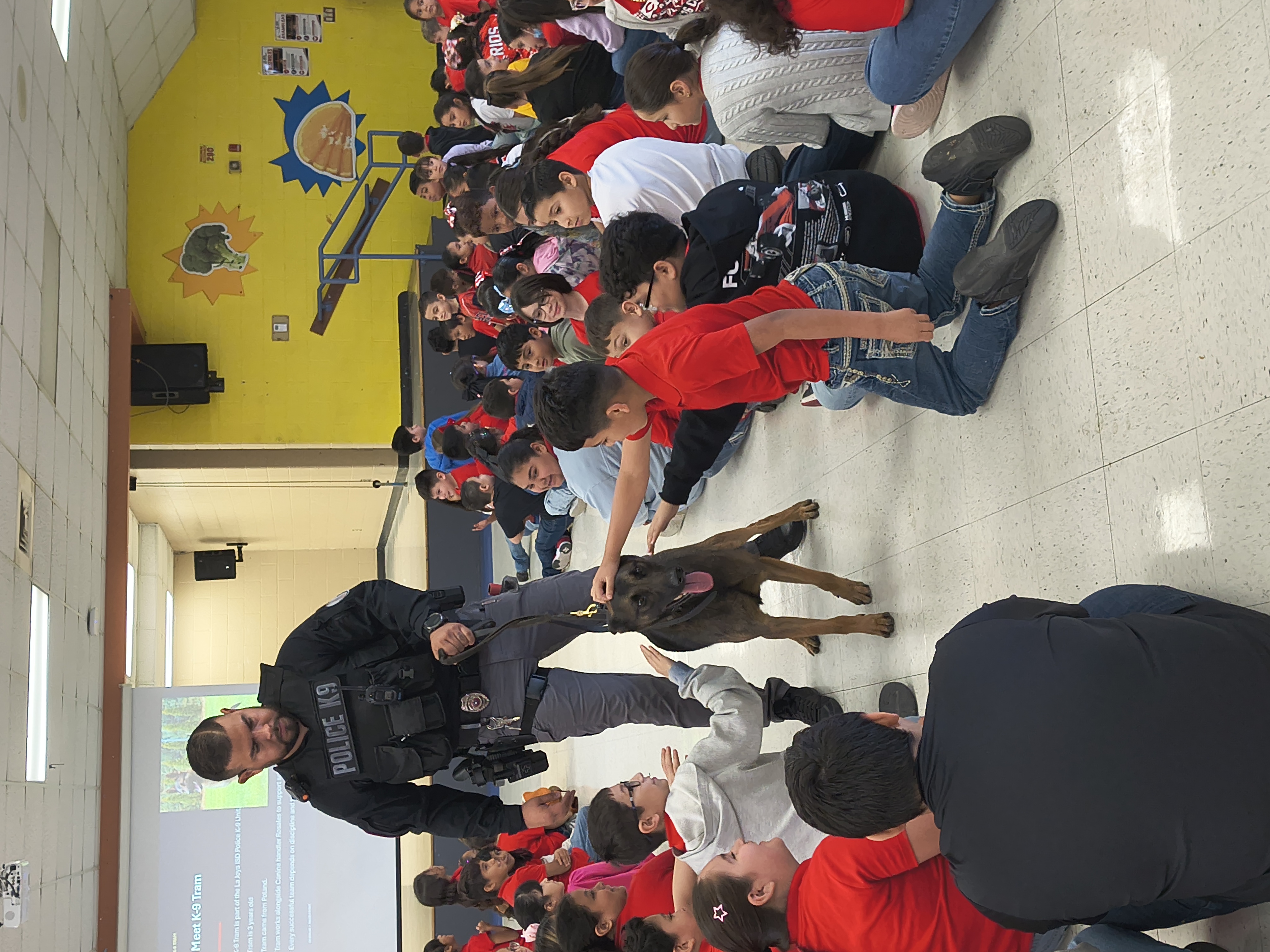 A police officer and a K9 Officer visited students.